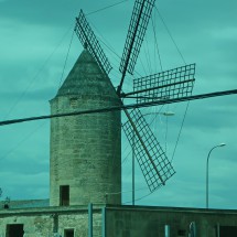 Typical windmill in Mallorca seen from the train between Inca and Manacor